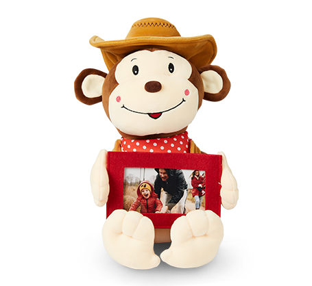 Singe cowboy en peluche